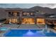 Luxury backyard with a sparkling pool, spa, and lounge area, perfect for outdoor entertaining at 2 Olympia Outlook Dr, Las Vegas, NV 89141
