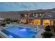 Luxury backyard with a sparkling pool, spa, and lounge area with mountain views at 2 Olympia Outlook Dr, Las Vegas, NV 89141