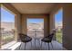 Cozy balcony with stylish seating and a captivating view, creating a perfect spot to unwind and enjoy the scenery at 2 Olympia Outlook Dr, Las Vegas, NV 89141