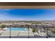 Breathtaking balcony view showcasing a sparkling pool and lush city landscape, creating an idyllic and serene outdoor retreat at 2 Olympia Outlook Dr, Las Vegas, NV 89141