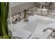 Close-up of a modern sink with a stylish faucet set on a granite countertop with elegant bath accessories at 2 Olympia Outlook Dr, Las Vegas, NV 89141