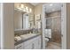 Bathroom featuring a modern vanity with square sink and walk-in shower with tile surround at 2 Olympia Outlook Dr, Las Vegas, NV 89141