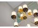 Elegant chandelier with multiple lights, showcasing modern design and complementing the room's ambiance at 2 Olympia Outlook Dr, Las Vegas, NV 89141