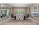 Elegant dining room with a large table, seating for six, and neutral color palette at 2 Olympia Outlook Dr, Las Vegas, NV 89141
