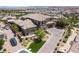 Beautiful home with a well-manicured lawn, driveway, and mature trees at 2 Olympia Outlook Dr, Las Vegas, NV 89141