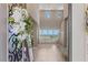 Bright, airy foyer with soaring ceilings, tile flooring, and a view into the spacious living area beyond at 2 Olympia Outlook Dr, Las Vegas, NV 89141