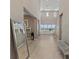 Spacious entryway featuring tile flooring, neutral walls, and a seamless transition to the living space at 2 Olympia Outlook Dr, Las Vegas, NV 89141