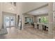 Two-story foyer with tile flooring open to a dining area with seating for six at 2 Olympia Outlook Dr, Las Vegas, NV 89141