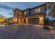 Charming home with a spacious driveway, ample garage space, and beautifully manicured shrubs and trees at 2 Olympia Outlook Dr, Las Vegas, NV 89141