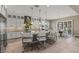 Well-lit kitchen with stainless appliances, central island, and adjacent breakfast nook at 2 Olympia Outlook Dr, Las Vegas, NV 89141