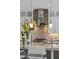 Stylish kitchen featuring stone backsplash, stainless steel appliances, and pendant lighting at 2 Olympia Outlook Dr, Las Vegas, NV 89141