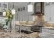 Gourmet kitchen boasts stone backsplash, stainless steel appliances, and granite countertops at 2 Olympia Outlook Dr, Las Vegas, NV 89141