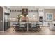 Beautiful kitchen with granite countertops, stone backsplash, a stainless steel hood, and bar stool seating at 2 Olympia Outlook Dr, Las Vegas, NV 89141