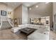 Elegant open-concept living area with a grand staircase and views leading to the modern kitchen at 2 Olympia Outlook Dr, Las Vegas, NV 89141