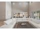 Bright open floor plan integrating the living room and kitchen for seamless entertaining and Gathering living at 2 Olympia Outlook Dr, Las Vegas, NV 89141