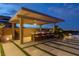 Outdoor kitchen and bar area perfect for entertaining with built-in grill and city views at 2 Olympia Outlook Dr, Las Vegas, NV 89141