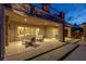 Covered outdoor living area with seating and easy access to the backyard and views at 2 Olympia Outlook Dr, Las Vegas, NV 89141