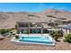 Stunning rear exterior featuring a modern pool, patio, and mountain views, perfect for luxurious outdoor living at 2 Olympia Outlook Dr, Las Vegas, NV 89141