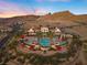 Aerial view of stunning community featuring pools, palms, cabanas and mountain views at 20 Via Visione # 104, Henderson, NV 89011