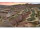 Aerial view of a community featuring multiple homes and a golf course at 20 Via Visione # 104, Henderson, NV 89011