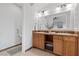 Bright bathroom with double sink vanity and decorative tile accents at 20 Via Visione # 104, Henderson, NV 89011
