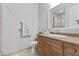 Bathroom featuring a single sink vanity and decorative tile accents at 20 Via Visione # 104, Henderson, NV 89011