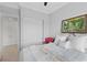 Cozy bedroom with neutral tones, closet doors, and a decorative painting at 20 Via Visione # 104, Henderson, NV 89011