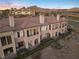 Aerial view of residential building exterior showcasing patios and desert landscaping at 20 Via Visione # 104, Henderson, NV 89011