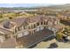 Stunning multi-Gathering exterior showcasing a tile roof, multiple garages, and gorgeous landscaping at 20 Via Visione # 104, Henderson, NV 89011