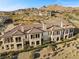 Multi-Gathering home in a community featuring a terracotta tile roof and desert landscaping at 20 Via Visione # 104, Henderson, NV 89011