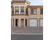 Charming multi-Gathering home boasting curb appeal, multiple garages, and inviting entryways at 20 Via Visione # 104, Henderson, NV 89011