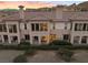 Beautiful multi-Gathering home featuring a terracotta tile roof, balconies, and desert landscaping at 20 Via Visione # 104, Henderson, NV 89011