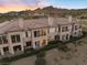 Beautiful multi-Gathering home featuring a terracotta tile roof and desert landscaping at 20 Via Visione # 104, Henderson, NV 89011