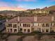 Elevated view of residential building exterior with patios and desert landscaping at 20 Via Visione # 104, Henderson, NV 89011
