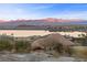 Picturesque lake view with the majestic mountains, a scene of tranquility and natural beauty at 20 Via Visione # 104, Henderson, NV 89011