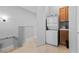 Upstairs laundry area with stacked washer and dryer at 20 Via Visione # 104, Henderson, NV 89011