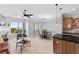 Open living space with neutral tones, eat in kitchen and water view at 20 Via Visione # 104, Henderson, NV 89011