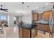 Open concept living space with kitchen and dining area, and door leading to patio at 20 Via Visione # 104, Henderson, NV 89011