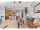 Open concept living space with kitchen, stairs, and modern living room furniture at 20 Via Visione # 104, Henderson, NV 89011