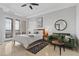 Bright main bedroom with private balcony, sitting area, and ceiling fan at 20 Via Visione # 104, Henderson, NV 89011
