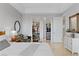 This main bedroom includes walk-in closets, and a comfortable seating area at 20 Via Visione # 104, Henderson, NV 89011