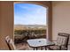 Inviting outdoor seating area with deer sculpture and lake views at 20 Via Visione # 104, Henderson, NV 89011