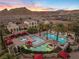 Multiple pools and cabanas create a private resort atmosphere with mountain views at 20 Via Visione # 104, Henderson, NV 89011