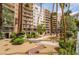 A luxury condo building with beautifully landscaped grounds, mature trees, and private walkways for residents to enjoy at 205 E Harmon Ave # 409, Las Vegas, NV 89169