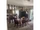 Cozy dining room features a decorative mirror wall and a warm carpet, creating an inviting atmosphere at 2574 Paradise Village Way, Las Vegas, NV 89120