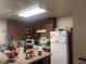 Functional kitchen featuring wood cabinetry and standard appliances at 2574 Paradise Village Way, Las Vegas, NV 89120