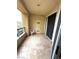 The balcony has tile floor, white chair, sliding glass doors, and a storage closet at 270 E Flamingo Rd # 214, Las Vegas, NV 89169