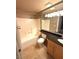 Full bathroom featuring a shower-tub combo, large mirror, vanity and granite countertop at 270 E Flamingo Rd # 214, Las Vegas, NV 89169