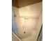 All-white shower stall with seating is a clean and efficient design at 270 E Flamingo Rd # 214, Las Vegas, NV 89169