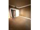 Bedroom featuring neutral carpeting, white trim and sliding-door closet at 270 E Flamingo Rd # 214, Las Vegas, NV 89169